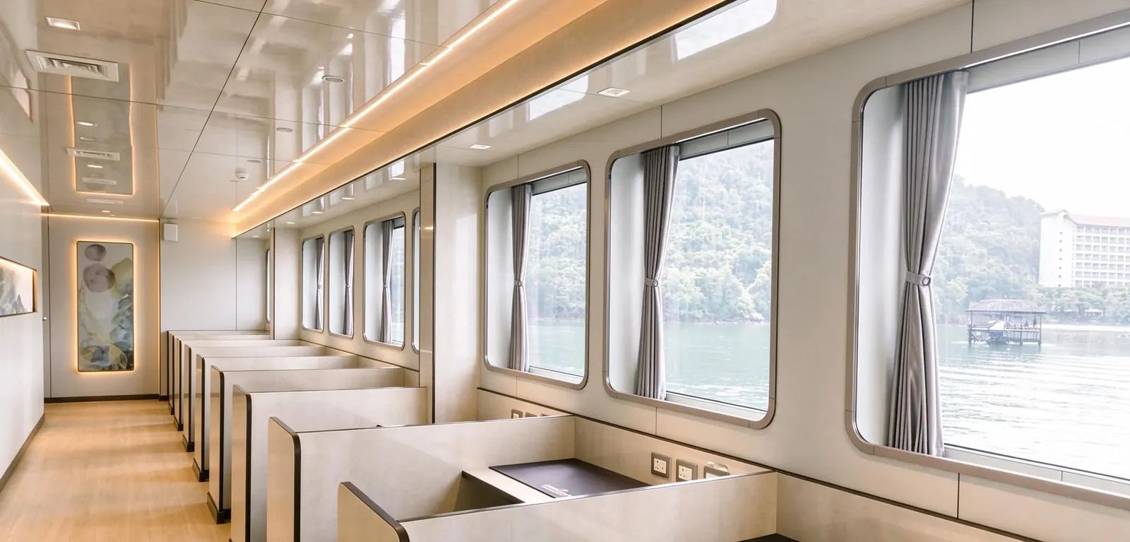 All Star Velocean liveaboard – camera workstations with power outlets along the windows – Indonesia