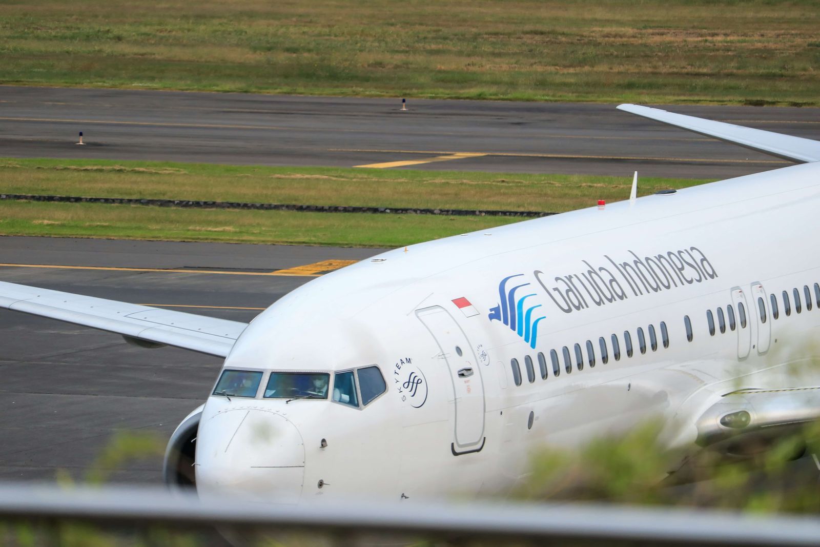 Garuda Indonesia aircraft runway Indonesian domestic flights liveaboard transfers
