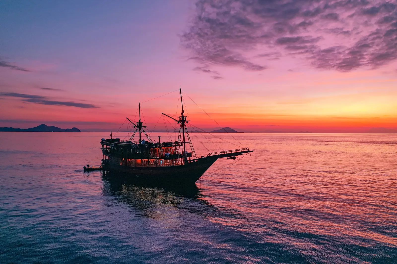 Malaillo liveaboard – sunset anchorage with tender alongside – Indonesia