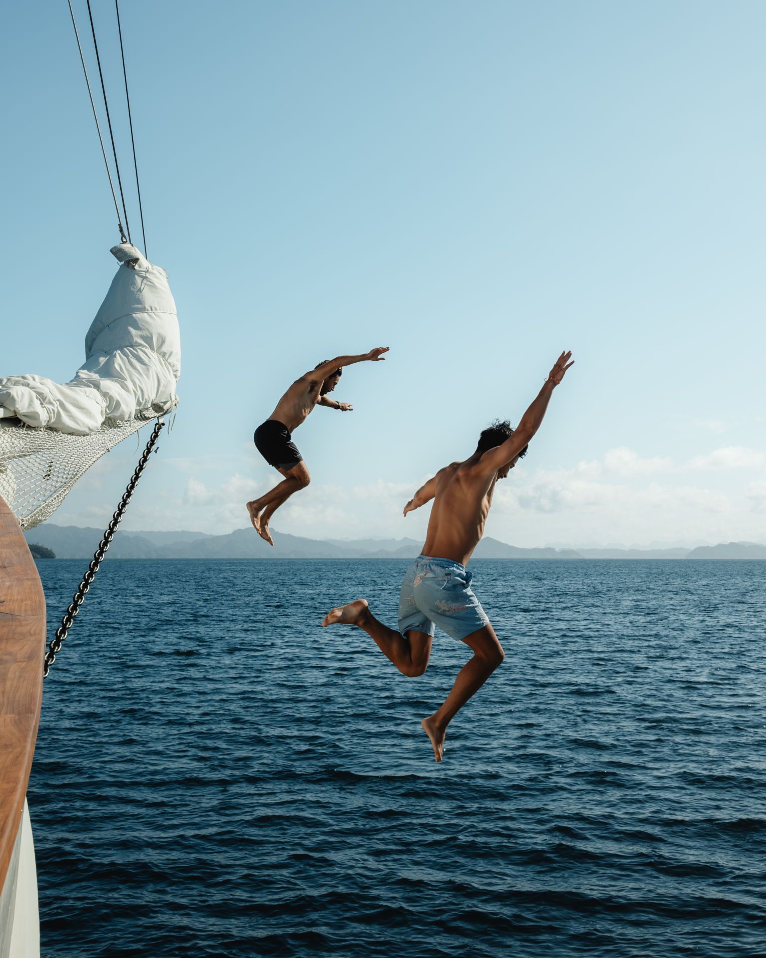 People jumping off boat