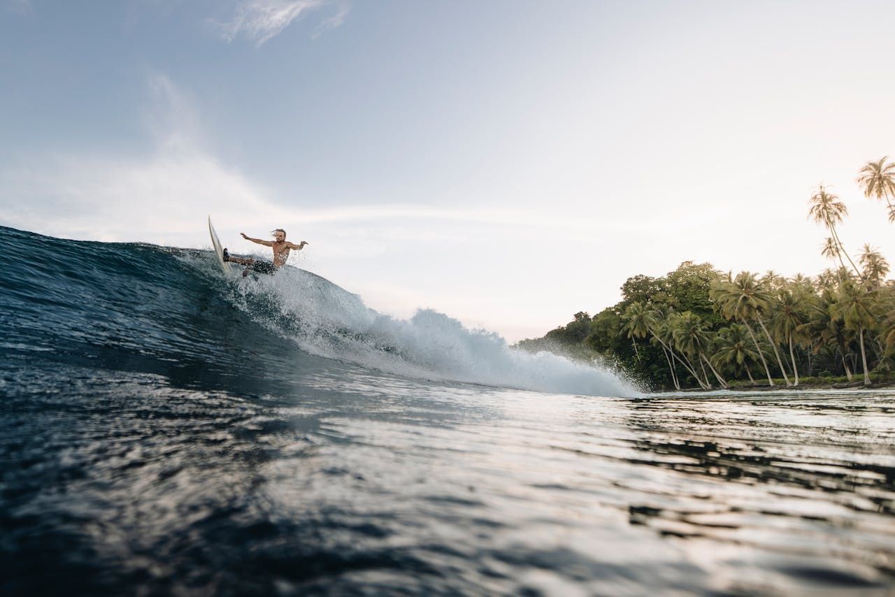 Surfing waves Mentawai Islands